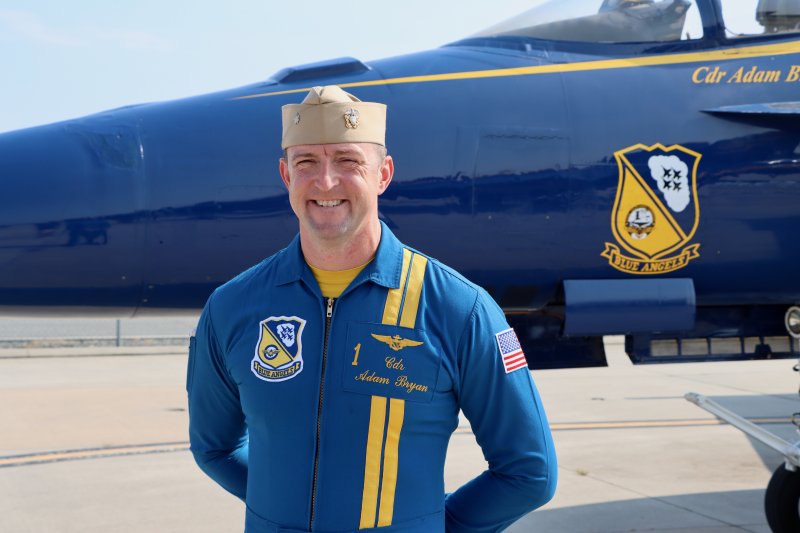 Commanding officer CDR Adam Bryan poses in front of his jet after arriving at NASA Wallops Island. The Connecticut native was flying over OC for the first time, although he said he had vacationed there in the past.